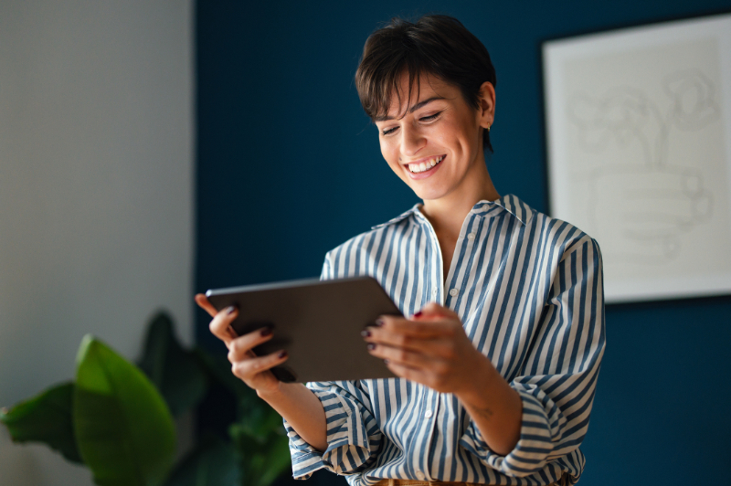 Portrait of a Beautiful Modern Business Woman Using Tablet in Her Office
