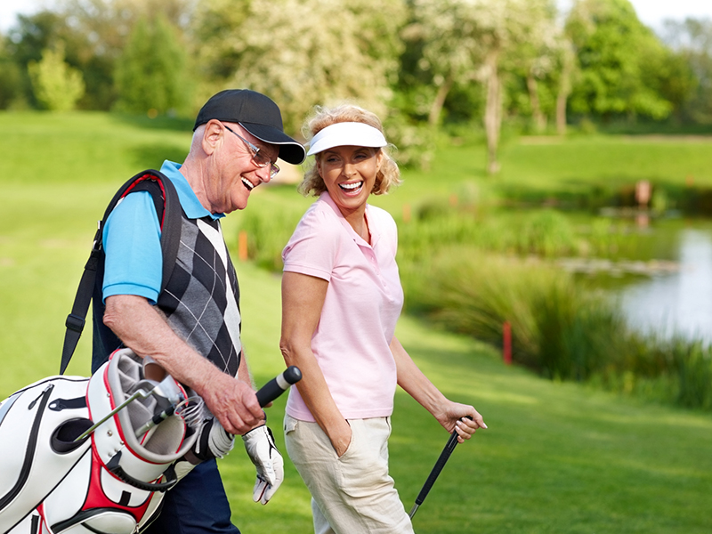 senior couple on the golf course